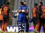 Afghanistan's batsmen Gulbadin Naib and Mohammad Nabi embrace after defeating Papua New Guinea's by 7 wicket in an ICC Men's T20 World Cup cricket match at Brian Lara Cricket Academy in Tarouba, Trinidad and Tobago Afghanistan's batsmen Gulbadin Naib and Mohammad Nabi embrace after defeating Papua New Guinea's by 7 wicket in an ICC Men's T20 World Cup cricket match at Brian Lara Cricket Academy in Tarouba, Trinidad and Tobago
