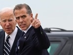 U.S. President Joe Biden stands with his son Hunter Biden, who earlier in the day was found guilty on all three counts in his criminal gun charges trial, after President Biden arrived at the Delaware Air National Guard Base in New Castle, Delaware, U.S., June 11, 2024. REUTERS/Anna Rose Layden