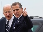 U.S. President Joe Biden stands with his son Hunter Biden, who earlier in the day was found guilty on all three counts in his criminal gun charges trial, after President Biden arrived at the Delaware Air National Guard Base in New Castle, Delaware, U.S., June 11, 2024. REUTERS/Anna Rose Layden