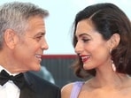 George Clooney, left, and his wife Amal Clooney pose for photographers upon arrival at the premiere of the film Suburbicon during the 74th edition of the Venice Film Festival in Venice, Italy.(Joel Ryan/Invision/AP) George Clooney, left, and his wife Amal Clooney pose for photographers upon arrival at the premiere of the film Suburbicon during the 74th edition of the Venice Film Festival in Venice, Italy.(Joel Ryan/Invision/AP)