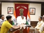 Union Education Minister Dharmendra Pradhan with students and their parents. Union Education Minister Dharmendra Pradhan with students and their parents.