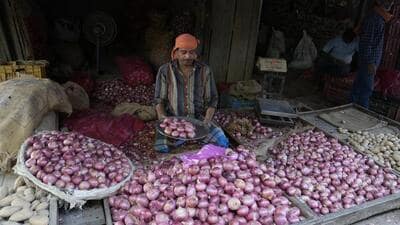 A vendor sells onions at a wholesale vegetable market in Prayagraj, Uttar Pradesh, India. (AP) A vendor sells onions at a wholesale vegetable market in Prayagraj, Uttar Pradesh, India. (AP)