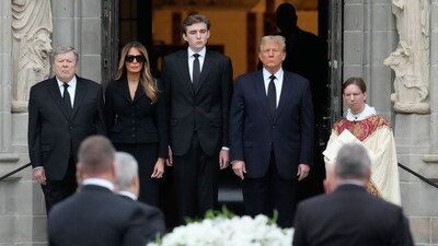 Former President Donald Trump, center right, stands with his wife Melania, second left, their son Barron, (AP Photo/Rebecca Blackwell) (AP) Former President Donald Trump, center right, stands with his wife Melania, second left, their son Barron, (AP Photo/Rebecca Blackwell) (AP)