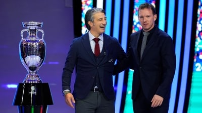 The head coaches of Switzerland Murat Yakin, left,and Germany Julian Nagelsmann, right, pose next to the trophy after the draw for the UEFA Euro 2024. (AP) The head coaches of Switzerland Murat Yakin, left,and Germany Julian Nagelsmann, right, pose next to the trophy after the draw for the UEFA Euro 2024. (AP)