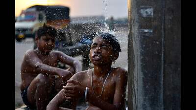 For Representation: Boys bathe at a public water facility along a street on a hot summer day in Jalandhar on June 13, 2024 amid heatwave. India's heatwave is the longest ever to hit the country, the government's top weather expert said on June 10 as he warned people will face increasingly oppressive temperatures. Parts of northern India have been gripped by a heatwave since mid-May, with temperatures soaring over 45 degrees Celsius (113 degrees Fahrenheit). (Photo by Shammi MEHRA / AFP) (AFP) For Representation: Boys bathe at a public water facility along a street on a hot summer day in Jalandhar on June 13, 2024 amid heatwave. India's heatwave is the longest ever to hit the country, the government's top weather expert said on June 10 as he warned people will face increasingly oppressive temperatures. Parts of northern India have been gripped by a heatwave since mid-May, with temperatures soaring over 45 degrees Celsius (113 degrees Fahrenheit). (Photo by Shammi MEHRA / AFP) (AFP)