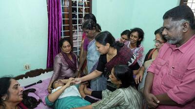 Indian politician, Veena George, who is Kerala's Minister for Health and Woman and Child Development, consoles the mother of Akash Sasidharan Nair, one of the victims of a fire that broke out in a building housing foreign workers in Kuwait, at Pathanamthitta district in the southern Indian state of Kerala on June 13 (REUTERS) Indian politician, Veena George, who is Kerala's Minister for Health and Woman and Child Development, consoles the mother of Akash Sasidharan Nair, one of the victims of a fire that broke out in a building housing foreign workers in Kuwait, at Pathanamthitta district in the southern Indian state of Kerala on June 13 (REUTERS)