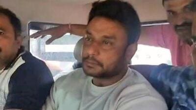 Kannada actor Darshan Thoogudeepa in police custody, in Bengaluru,on Tuesday. (ANI) Kannada actor Darshan Thoogudeepa in police custody, in Bengaluru,on Tuesday. (ANI)