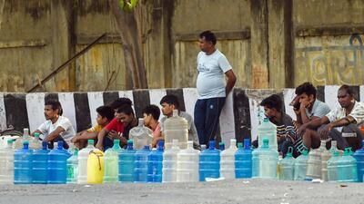 Residents of Chilla village wait for water tankers on Friday. (Raj K Raj/HT) Residents of Chilla village wait for water tankers on Friday. (Raj K Raj/HT)