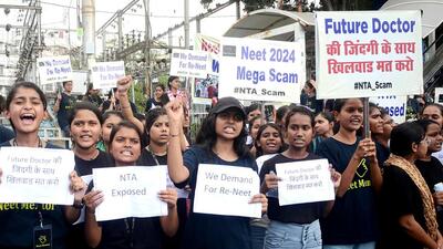 Students holding placards protest against the alleged irregularities in the NEET examination, in Bhopal on Friday. (ANI) Students holding placards protest against the alleged irregularities in the NEET examination, in Bhopal on Friday. (ANI)