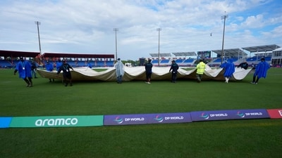 Groundsmen pull the covers off the field at the Central Broward Regional Park Stadium in Lauderhill (AP) Groundsmen pull the covers off the field at the Central Broward Regional Park Stadium in Lauderhill (AP)