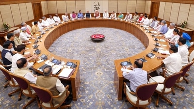 This handout photograph taken and released on June 10, 2024 by the Indian Press Information Bureau (PIB) shows India's Prime Minister Narendra Modi (C) holding the first cabinet meeting, in New Delhi (AFP)