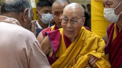 Tibetan spiritual leader the Dalai Lama greets a guest as he leaves after attending a special event during which exile Tibetans made him traditional offerings and prayed for his long life, at the Tsuglakhang temple in Dharamshala on June 11. (AP) Tibetan spiritual leader the Dalai Lama greets a guest as he leaves after attending a special event during which exile Tibetans made him traditional offerings and prayed for his long life, at the Tsuglakhang temple in Dharamshala on June 11. (AP)