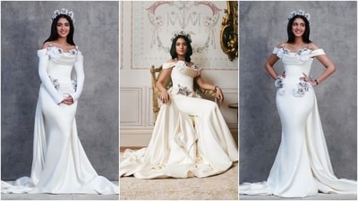 Radhika wore another custom haute couture look for her pre-wedding festivities. She donned a majestic ivory double satin draped gown by Tamara Ralph, styled by Rhea Kapoor. It features a dramatic overskirt adorned with white silk and encrusted crystal roses. The off-shoulder neckline, crystal rose headband, and floor-sweeping train added to its beauty. (Instagram/@rheakapoor) Radhika wore another custom haute couture look for her pre-wedding festivities. She donned a majestic ivory double satin draped gown by Tamara Ralph, styled by Rhea Kapoor. It features a dramatic overskirt adorned with white silk and encrusted crystal roses. The off-shoulder neckline, crystal rose headband, and floor-sweeping train added to its beauty. (Instagram/@rheakapoor)
