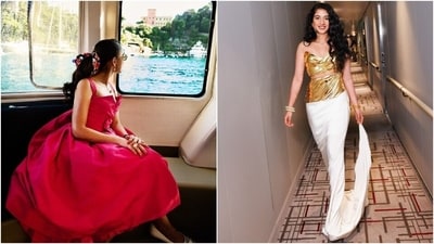 Radhika wore an archival piece from Dior and a custom couture piece by Grace Ling for two different events during her pre-wedding festivities in Italy. For the grand gala in Portofino, Radhika embraced the Barbiecore trend in a raspberry pink cocktail dress from Christian Dior's Autumn Winter 1959 Haute Couture collection designed by Yves Saint Laurent. Meanwhile, the Grace Ling 3D-carved gold bust, and the white satin floor-grazing skirt transformed Radhika into a space goddess. She styled the ensemble with gold bracelets, rings, drop earrings, striking makeup, and loose curly locks. (German Larkin, Signe Vilstrup) Radhika wore an archival piece from Dior and a custom couture piece by Grace Ling for two different events during her pre-wedding festivities in Italy. For the grand gala in Portofino, Radhika embraced the Barbiecore trend in a raspberry pink cocktail dress from Christian Dior's Autumn Winter 1959 Haute Couture collection designed by Yves Saint Laurent. Meanwhile, the Grace Ling 3D-carved gold bust, and the white satin floor-grazing skirt transformed Radhika into a space goddess. She styled the ensemble with gold bracelets, rings, drop earrings, striking makeup, and loose curly locks. (German Larkin, Signe Vilstrup)