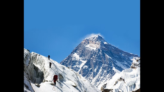 Everest as seen from Gokyo valley. Today, climbers get endless oxygen supply, are airlifted beyond Base Camp, hire Sherpas to do the heavy lifting. The result: alarming numbers of climbers this spring. (Adobe Stock)