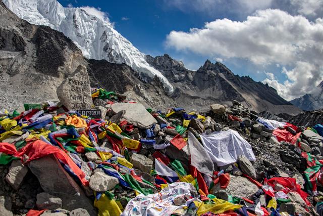 A file photo from 2018 shows some of the prayer flags and celebratory messages left behind at Base Camp. (Adobe Stock)