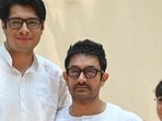 Bollywood actor Aamir Khan (C) with his sons Junaid Khan (L) and Azad Khan (R) celebrate Eid al-Fitr which marks the end of the holy Muslim fasting month of Ramadan, in Mumbai on April 11, 2024. (Photo by SUJIT JAISWAL / AFP) (AFP)