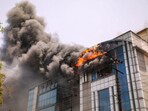 Smoke billows out after a fire broke out in two companies in Noida on Saturday, June 15, 2024.