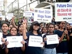 Students holding placards protest against the alleged irregularities in the NEET examination, in Bhopal on Friday. (ANI) Students holding placards protest against the alleged irregularities in the NEET examination, in Bhopal on Friday. (ANI)