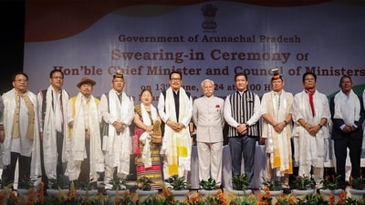 Arunachal Pradesh Governor KT Parnaik in picture with the newly sworn state Chief Minister Pema Khandu and his Cabinet ministers during a swearing-in ceremony, in Itanagar on Thursday. (ANI) Arunachal Pradesh Governor KT Parnaik in picture with the newly sworn state Chief Minister Pema Khandu and his Cabinet ministers during a swearing-in ceremony, in Itanagar on Thursday. (ANI)