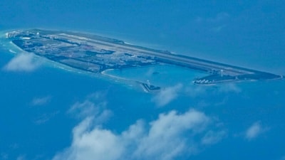 Chinese structures and buildings on the man-made Fiery Cross Reef at the Spratlys group of islands in the South China Sea . (AP) Chinese structures and buildings on the man-made Fiery Cross Reef at the Spratlys group of islands in the South China Sea . (AP)