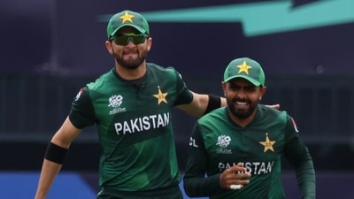 Pakistan's Babar Azam celebrates with Shaheen Shah Afridi after taking the wicket of India's Rishabh Pant (REUTERS)