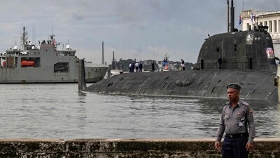 Russian Marines standing on top of the Russian nuclear-powered submarine Kazan (R), part of the Russian naval detachment visiting Cuba. (Photo by YAMIL LAGE / AFP) (AFP) Russian Marines standing on top of the Russian nuclear-powered submarine Kazan (R), part of the Russian naval detachment visiting Cuba. (Photo by YAMIL LAGE / AFP) (AFP)