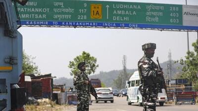 Central Reserve Police Force (CRPF) personnel standing guard at the national highway ahead of the annual Amarnath Yatra in Jammu on Saturday. (PTI Photo) Central Reserve Police Force (CRPF) personnel standing guard at the national highway ahead of the annual Amarnath Yatra in Jammu on Saturday. (PTI Photo)