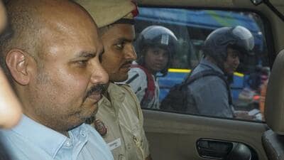 Delhi Police personnel with CM Arvind Kejriwal’s aide Bibhav Kumar leaving Kejriwal's residence after recreation of the scene in AAP MP Swati Maliwal's assault case on May 20, 2024. (PTI) Delhi Police personnel with CM Arvind Kejriwal’s aide Bibhav Kumar leaving Kejriwal's residence after recreation of the scene in AAP MP Swati Maliwal's assault case on May 20, 2024. (PTI)