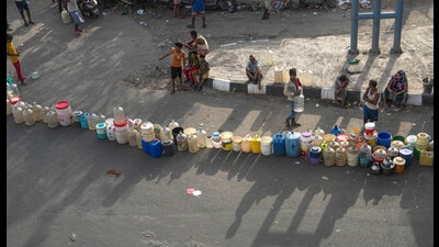 People wait to collect drinking water from a tanker of Delhi Jal Board at a slum in Geeta Colony area on Saturday. (PTI) People wait to collect drinking water from a tanker of Delhi Jal Board at a slum in Geeta Colony area on Saturday. (PTI)