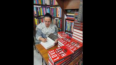 Rakhshanda Jalil signs the book ‘Love In The Times of Hate’. (HT photo) Rakhshanda Jalil signs the book ‘Love In The Times of Hate’. (HT photo)