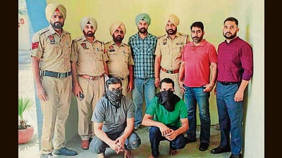 The accused who opened fire at a jewellery showroom in Doraha in custody of Ludhiana police on Saturday. (HT Photo) The accused who opened fire at a jewellery showroom in Doraha in custody of Ludhiana police on Saturday. (HT Photo)