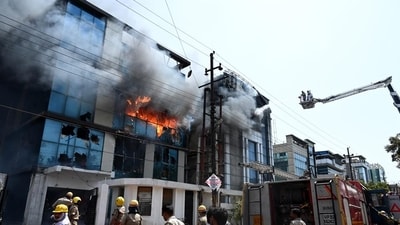 Thick black smoke billowing out of the building was visible from nearby areas, prompting several residents to share videos of the same on the social media websites. (Sunil Ghosh/HT Photo) Thick black smoke billowing out of the building was visible from nearby areas, prompting several residents to share videos of the same on the social media websites. (Sunil Ghosh/HT Photo)