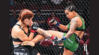 With great flurries of punch combinations and explosive kicks, Puja Tomar beat Rayanne Amanda dos Santos of Brazil at the Ultimate Fighting Championship in Louisville. (Getty Images) With great flurries of punch combinations and explosive kicks, Puja Tomar beat Rayanne Amanda dos Santos of Brazil at the Ultimate Fighting Championship in Louisville. (Getty Images)