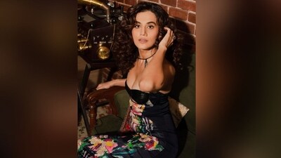 With the assistance of hairstylist Seema Mane, Taapsee embraced her luscious curly tresses, leaving them open in a side part to cascade beautifully down her shoulders, perfectly complementing her chic look. (Instagram/@taapsee) With the assistance of hairstylist Seema Mane, Taapsee embraced her luscious curly tresses, leaving them open in a side part to cascade beautifully down her shoulders, perfectly complementing her chic look. (Instagram/@taapsee)