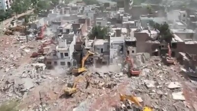 Drone footage captures demolition of illegal constructions in Kukrail riverbed. (Lucknow Development Authority)