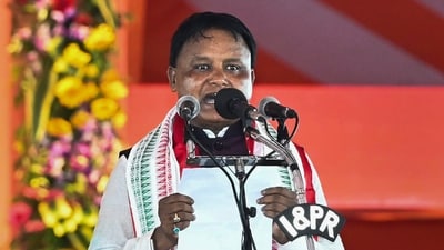 Odisha Chief Minister-designate Mohan Charan Majhi takes oath during the swearing-in ceremony of the new Odisha government, in Bhubaneswar, Wednesday, June 12, 2024. (PTI)