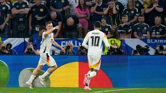 Germany's Florian Wirtz, left, celebrates with Jamal Musiala after scoring their opening goal vs Scotland. (AP)