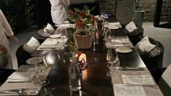 Shibani Dandekar shared another photo, albeit a blurry one, of a dinner table set up at the property as they hosted the singer-actor as well as Amrita Arora and others.