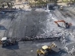 Debris being removed from the game zone site where a fire broke out on Saturday, in Rajkot on May 27. (PTI)