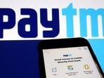 The interface of payments app Paytm is seen in front of its logo displayed in this illustration picture (Reuters)