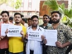 Students holding placards protest against the alleged irregularities in the NEET examination, at Shashtri Bhawan in New Delhi on Friday. Students holding placards protest against the alleged irregularities in the NEET examination, at Shashtri Bhawan in New Delhi on Friday.