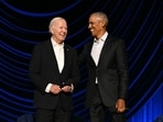 TOPSHOT - US President Joe Biden (L) stands with former US President Barack Obama onstage during a campaign fundraiser at the Peacock Theater in Los Angeles on June 15, 2024. 