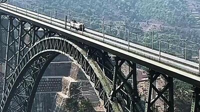 A train runs on the newly constructed world's highest railway bridget between Sangaldan in Ramban district and Reasi. (ANI) A train runs on the newly constructed world's highest railway bridget between Sangaldan in Ramban district and Reasi. (ANI)