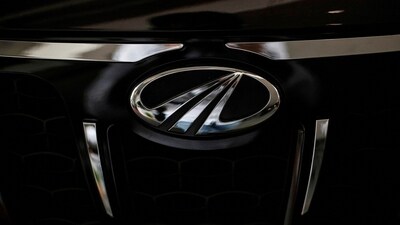The logo of Mahindra & Mahindra is seen on a car at a showroom in Mumbai (Reuters)