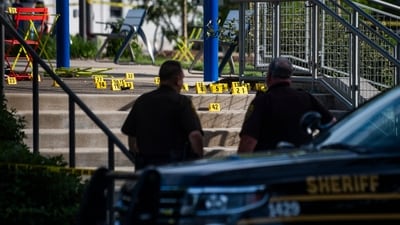 Officials with the Oakland County Sheriff's Department, Rochester Hills Fire Department and other jurisdictions secure the scene of a shooting at the Brooklands Plaza Splash Pad. (AP)