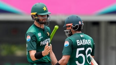 Pakistan's Shaheen Shah Afridi, left, celebrates with captain Babar Azam (PTI) Pakistan's Shaheen Shah Afridi, left, celebrates with captain Babar Azam (PTI)