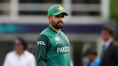 Pakistan's captain Babar Azam waits for the coin toss before the beginning of the ICC Men's T20 World Cup cricket match between Ireland and Pakistan (AP) Pakistan's captain Babar Azam waits for the coin toss before the beginning of the ICC Men's T20 World Cup cricket match between Ireland and Pakistan (AP)