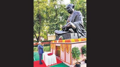 Vice President Jagdeep Dhankhar pays tribute at the statue of Mahatma Gandhi at the Prerna Sthal, on Sunday. (PTI) Vice President Jagdeep Dhankhar pays tribute at the statue of Mahatma Gandhi at the Prerna Sthal, on Sunday. (PTI)