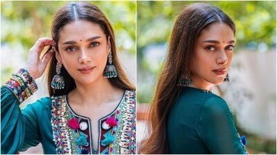 The anarkali set features colourful gota and thread embroidery and sequin embellishments. The kurta has full-length sleeves, a cinched detail under the bust, a pleated skirt, and a relaxed silhouette, while the pants have a flared design. She styled the ensemble with oxidised jhumkis, embellished juttis, a bindi, brown eye shadow, a mauve lip shade, and centre-parted open tresses. (Instagram) The anarkali set features colourful gota and thread embroidery and sequin embellishments. The kurta has full-length sleeves, a cinched detail under the bust, a pleated skirt, and a relaxed silhouette, while the pants have a flared design. She styled the ensemble with oxidised jhumkis, embellished juttis, a bindi, brown eye shadow, a mauve lip shade, and centre-parted open tresses. (Instagram)